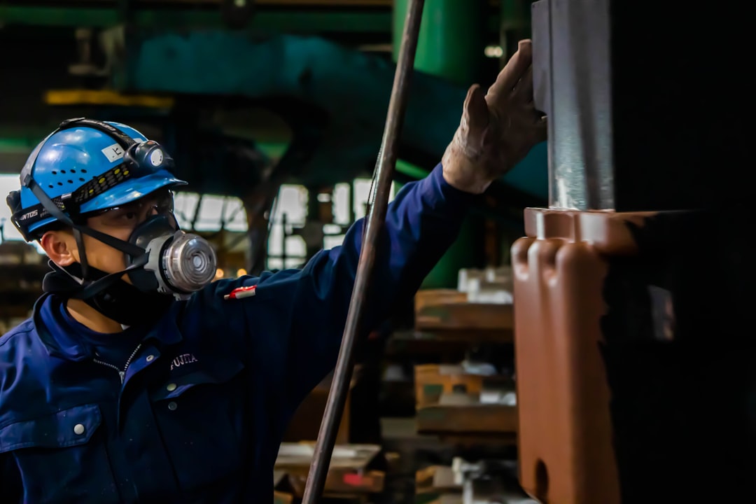 Industrial worker using protective equipment during air monitoring and controlled reentry