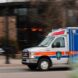 Ambulance in motion representing the effect of prehospital time on trauma outcomes
