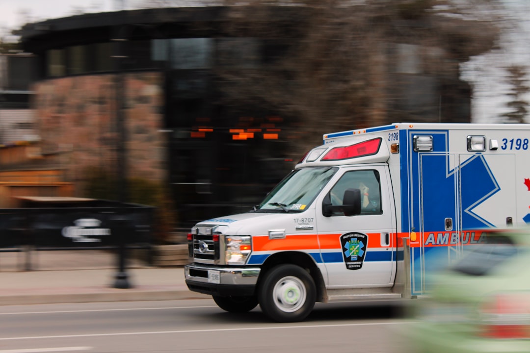 Ambulance in motion representing the effect of prehospital time on trauma outcomes