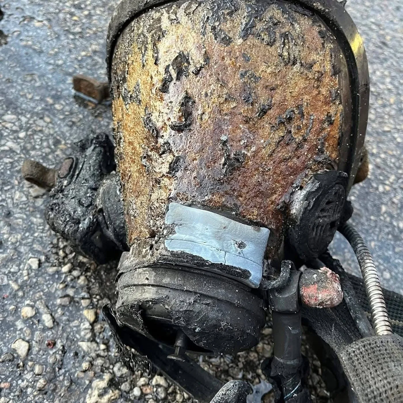 SCBA facepiece showing thermal damage after the Houston apartment flashover