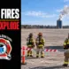 Fire crews assess a distant smoking silo from an established perimeter.